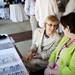 Executive Assistant to Superintendent JoAnn Emmendorfer talks with Executive Assistant to Board of Education Amy Osinski while guests check in the the Ann Arbor Public Schools retirement party on Tuesday, June 18. Daniel Brenner I AnnArbor.com